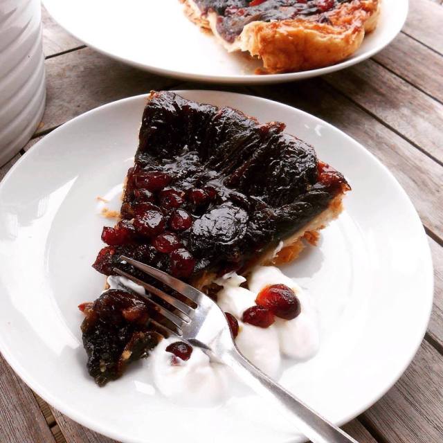 onion tart with fork and cream